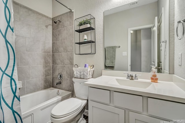 8922 Trail Dust, San Antonio, TX 78254 - bathroom featuring a textured wall, toilet, shower / tub combo with curtain, and vanity