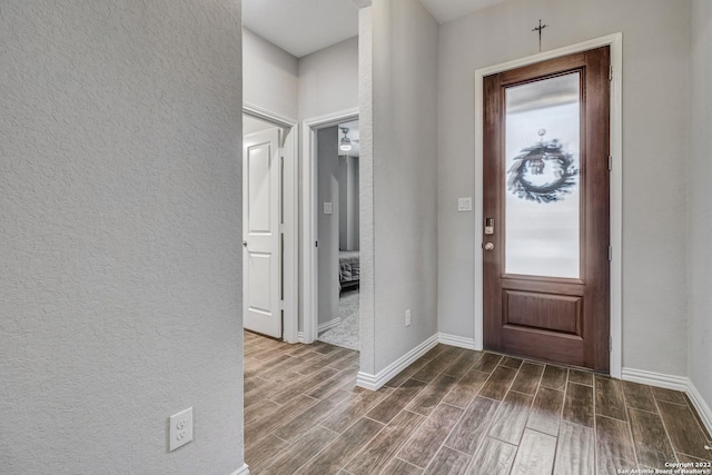 8922 Trail Dust, San Antonio, TX 78254 - entryway with dark wood-style floors, baseboards, and a textured wall