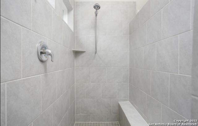 8922 Trail Dust, San Antonio, TX 78254 - full bathroom featuring tiled shower