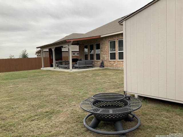 8922 Trail Dust, San Antonio, TX 78254 - view of yard featuring a patio, a ceiling fan, and an outdoor living space