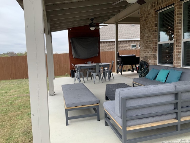 8922 Trail Dust, San Antonio, TX 78254 - fenced backyard featuring a ceiling fan, outdoor lounge area, a patio area, area for grilling, and outdoor dining area