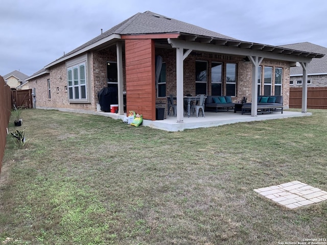 8922 Trail Dust, San Antonio, TX 78254 - back of property with an outdoor hangout area, brick siding, a patio, and a shingled roof