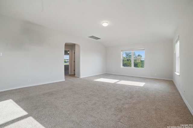 21902 Backspin, San Antonio, TX 78261 - unfurnished room with arched walkways, light colored carpet, and baseboards