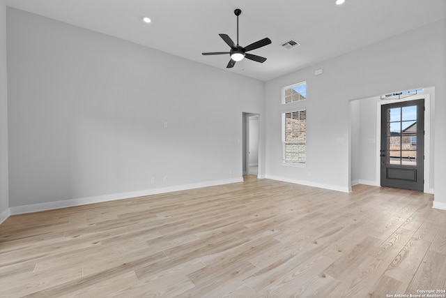190 Azalea Aly, Castroville, TX 78009 - unfurnished room with ceiling fan, light wood-style floors, a high ceiling, baseboards, and recessed lighting