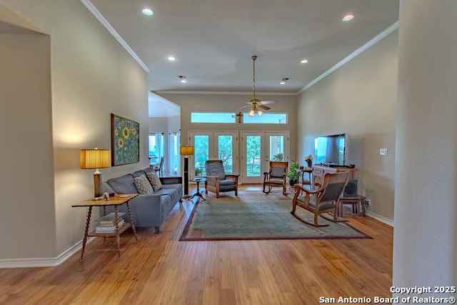 228 Long Crk, New Braunfels, TX 78130 - living room with ornamental molding, wood finished floors, baseboards, recessed lighting, and ceiling fan