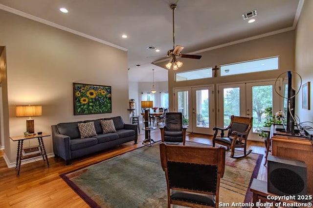 228 Long Crk, New Braunfels, TX 78130 - living area featuring ceiling fan, light wood finished floors, french doors, crown molding, and recessed lighting