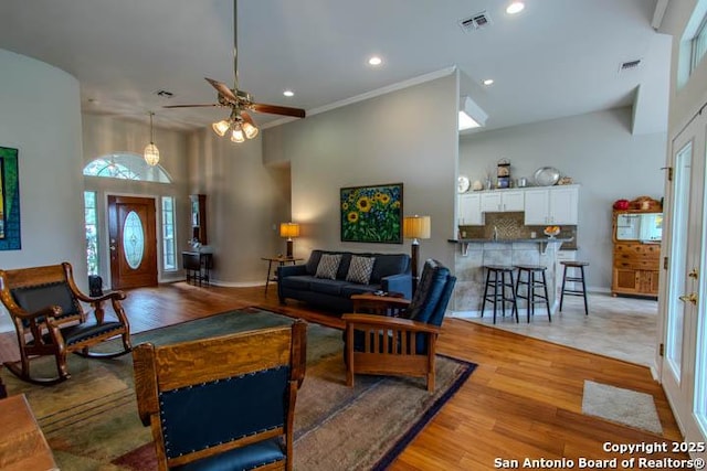 228 Long Crk, New Braunfels, TX 78130 - living room featuring light wood finished floors, ceiling fan, recessed lighting, a high ceiling, and baseboards