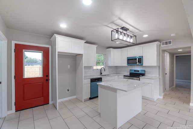 206 Scott, Universal City, TX 78148 - kitchen featuring stainless steel appliances, a sink, tasteful backsplash, white cabinets, and recessed lighting