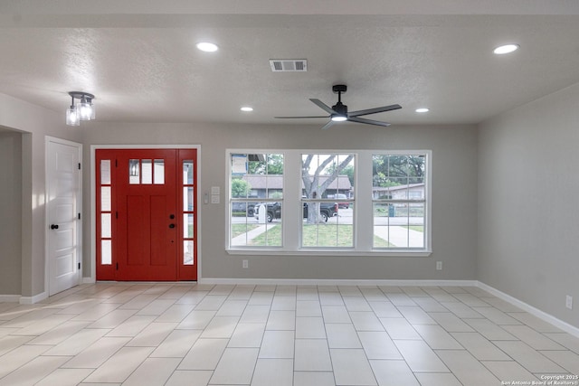 206 Scott, Universal City, TX 78148 - foyer entrance with a ceiling fan, baseboards, recessed lighting, a textured ceiling, and light tile patterned flooring