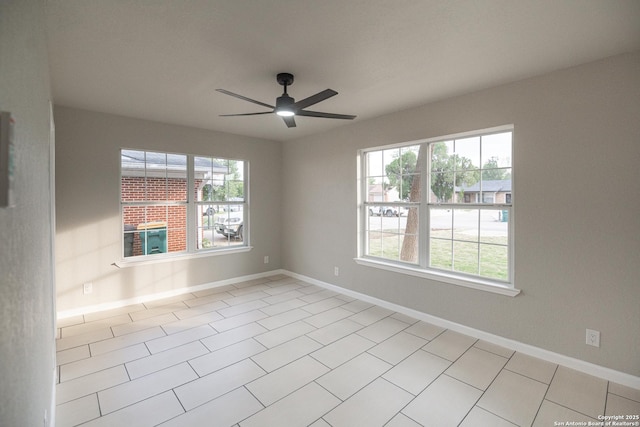 206 Scott, Universal City, TX 78148 - unfurnished room featuring ceiling fan, baseboards, and light tile patterned floors