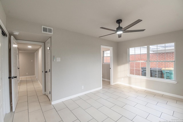 206 Scott, Universal City, TX 78148 - unfurnished room with a ceiling fan, baseboards, light tile patterned flooring, and a smoke detector