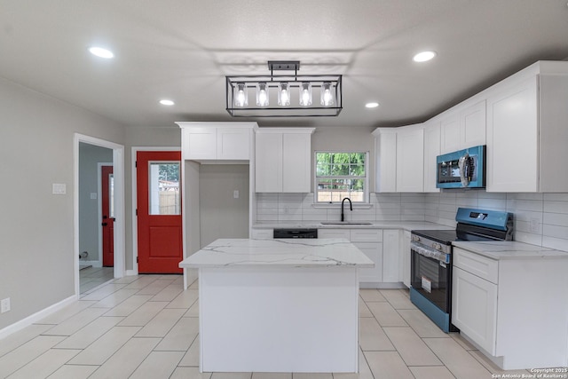 206 Scott, Universal City, TX 78148 - kitchen featuring appliances with stainless steel finishes, a sink, tasteful backsplash, a center island, and recessed lighting