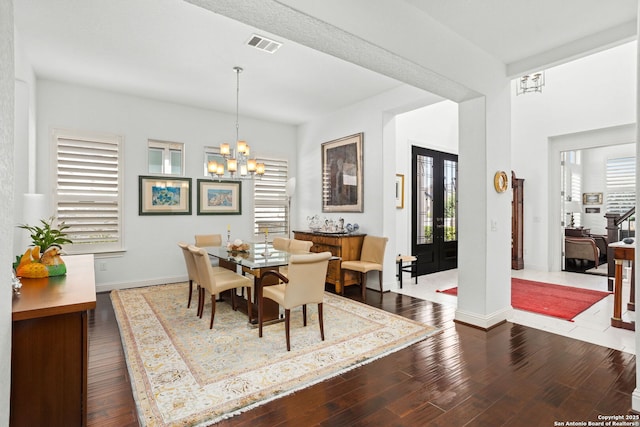 17 Denbury, San Antonio, TX 78257 - dining space featuring a chandelier, dark wood-type flooring, and baseboards