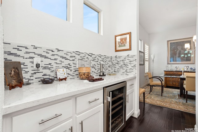 17 Denbury, San Antonio, TX 78257 - indoor bar with beverage cooler, dark wood-style floors, healthy amount of natural light, and decorative backsplash