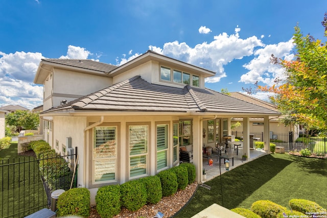 17 Denbury, San Antonio, TX 78257 - back of house with stucco siding, a patio area, and a tiled roof