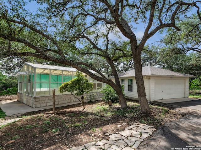 100 Tomahawk Hl, Country Village, TX 78232 - view of home's exterior with driveway and a garage