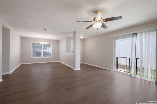 8314 Morning Grv, Converse, TX 78109 - spare room with a chandelier, dark wood finished floors, a ceiling fan, and baseboards