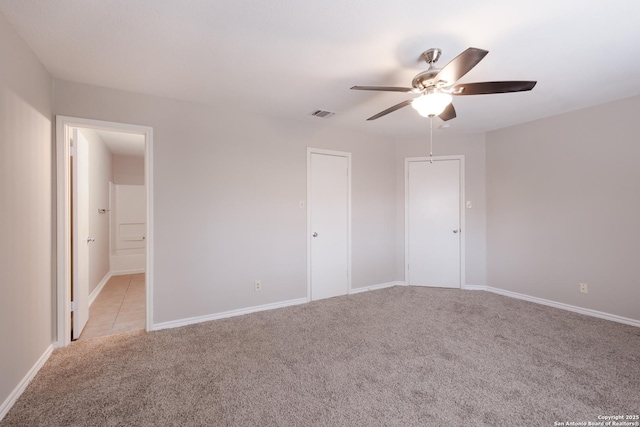 8314 Morning Grv, Converse, TX 78109 - unfurnished bedroom with light carpet, baseboards, and a ceiling fan