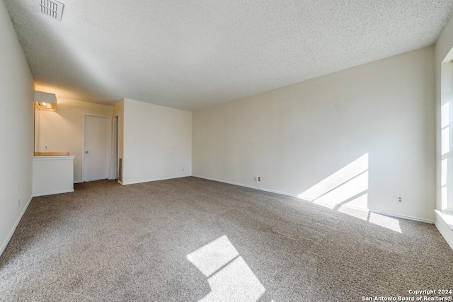 2514 Silver Rdg, San Antonio, TX 78232 - carpeted empty room with a textured ceiling and baseboards