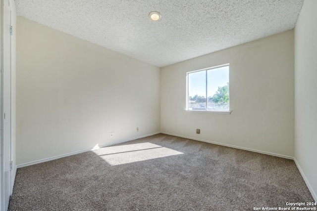 2514 Silver Rdg, San Antonio, TX 78232 - unfurnished room featuring carpet, a textured ceiling, and baseboards