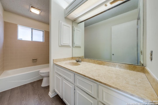 2514 Silver Rdg, San Antonio, TX 78232 - bathroom featuring wood finished floors, toilet, vanity, and tub / shower combination