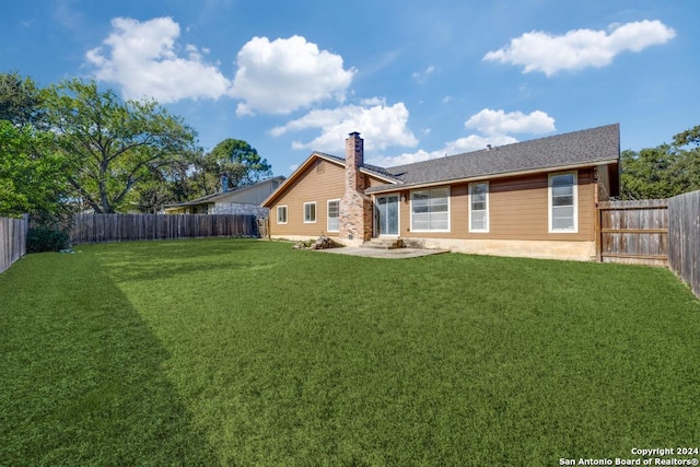 2514 Silver Rdg, San Antonio, TX 78232 - rear view of property with a chimney and a patio area