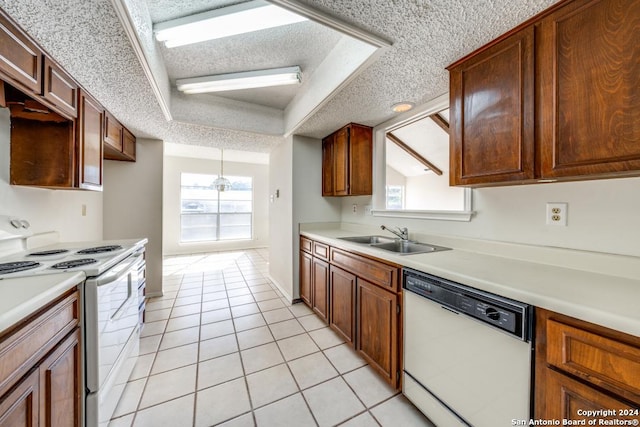 2514 Silver Rdg, San Antonio, TX 78232 - kitchen featuring white appliances, a sink, a textured ceiling, light countertops, and light tile patterned flooring