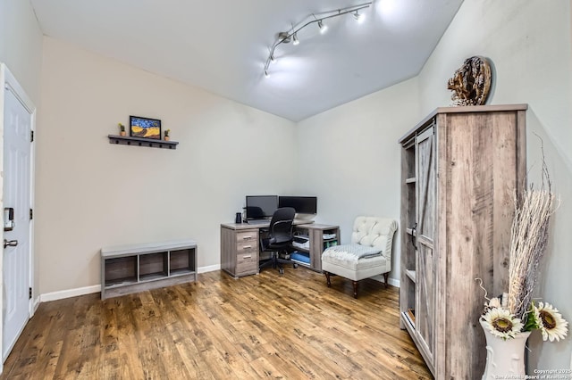 8010 Indian Bnd, San Antonio, TX 78250 - office area featuring track lighting, wood finished floors, vaulted ceiling, and baseboards