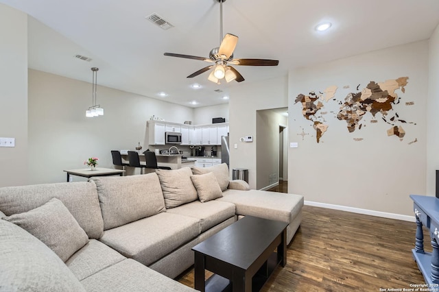 8010 Indian Bnd, San Antonio, TX 78250 - living room with dark wood-style flooring, a ceiling fan, baseboards, and recessed lighting
