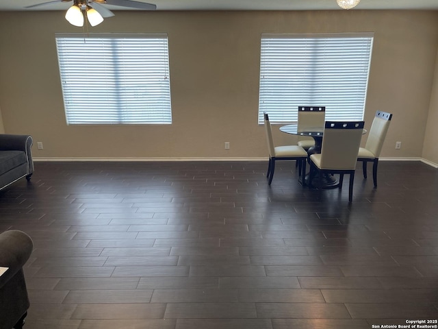 12242 Bening Vly, Schertz, TX 78154 - dining area with a ceiling fan, baseboards, and dark wood-style flooring