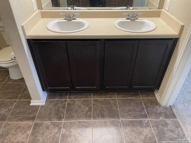 12242 Bening Vly, Schertz, TX 78154 - full bathroom featuring double vanity and toilet