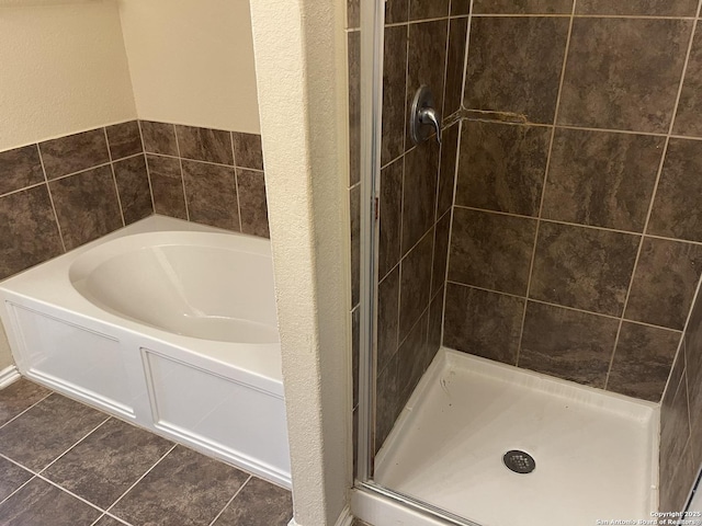 12242 Bening Vly, Schertz, TX 78154 - full bathroom with a bath, a stall shower, and tile patterned flooring