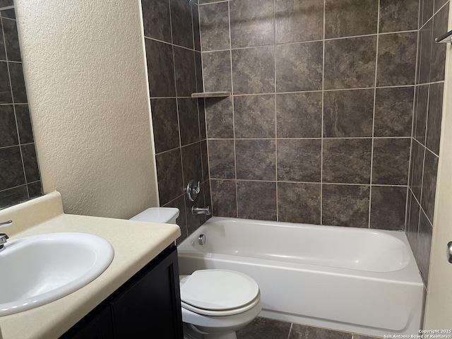 12242 Bening Vly, Schertz, TX 78154 - bathroom with a textured wall, toilet, vanity, and shower / washtub combination
