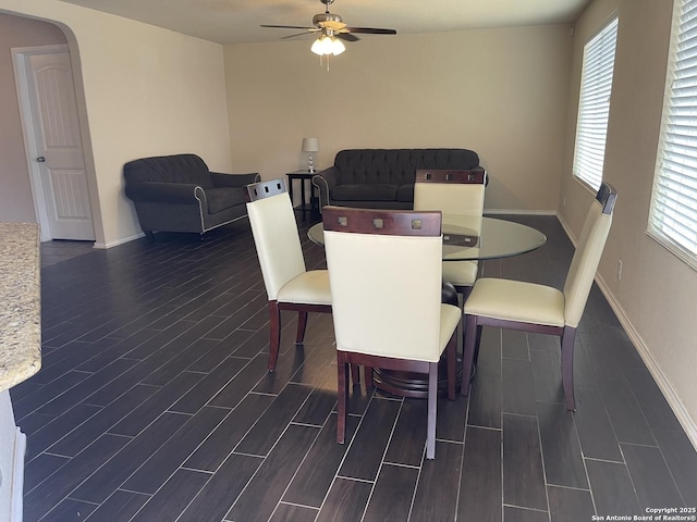 12242 Bening Vly, Schertz, TX 78154 - dining room featuring dark wood-style flooring, ceiling fan, and plenty of natural light