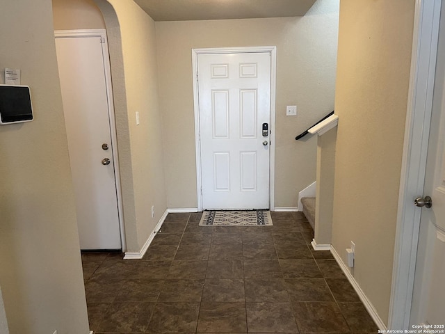 12242 Bening Vly, Schertz, TX 78154 - doorway featuring arched walkways, baseboards, and stairs