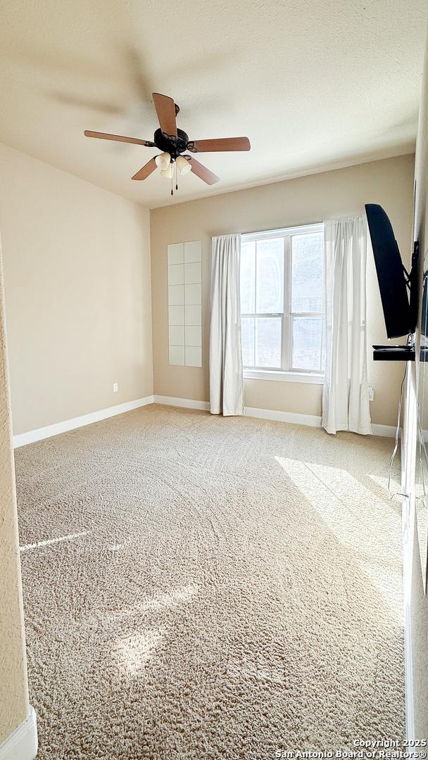 4171 Texas Elm, San Antonio, TX 78230 - carpeted empty room featuring a ceiling fan and baseboards