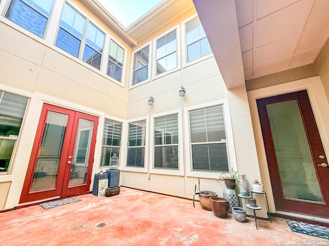 4171 Texas Elm, San Antonio, TX 78230 - view of exterior entry with stucco siding, french doors, and a patio area