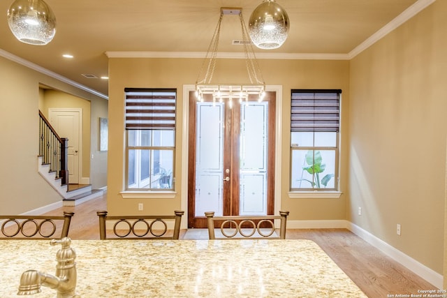 4171 Texas Elm, San Antonio, TX 78230 - entryway featuring wood finished floors, stairway, baseboards, healthy amount of natural light, and crown molding
