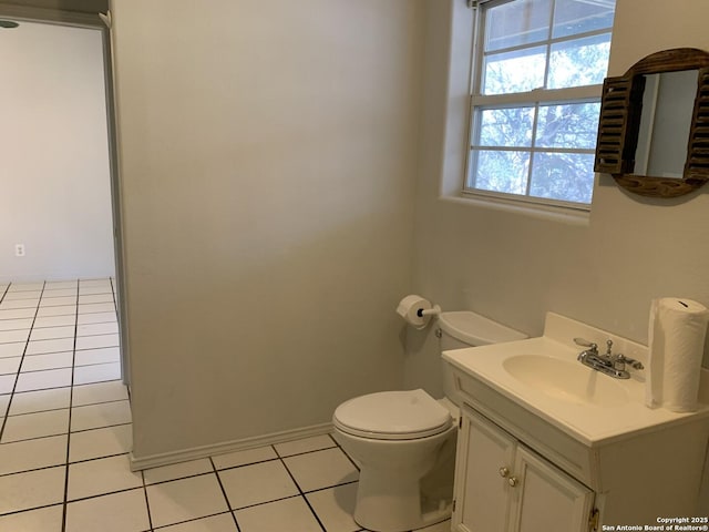 1076 Eastview, Canyon Lake, TX 78133 - half bath with tile patterned floors, toilet, vanity, and baseboards