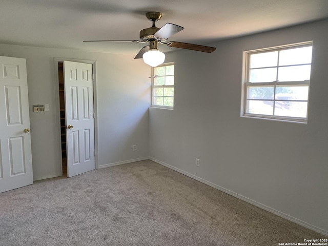 1076 Eastview, Canyon Lake, TX 78133 - spare room with carpet, a ceiling fan, and baseboards