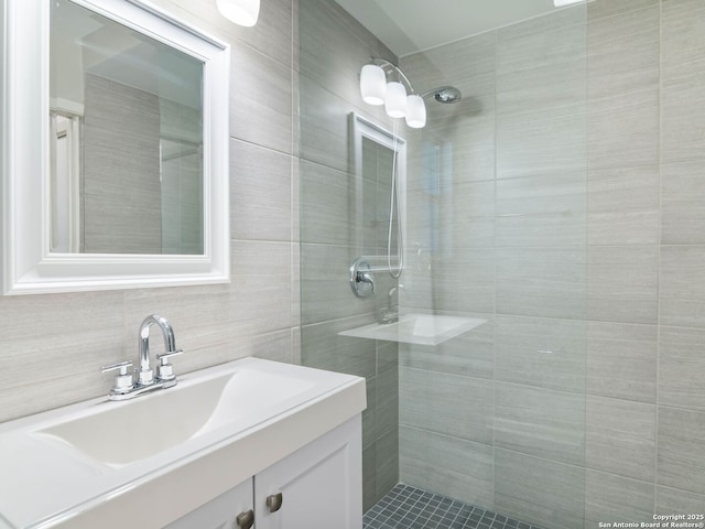 602 Northridge, San Antonio, TX 78209 - full bathroom featuring vanity, tiled shower, and tile walls