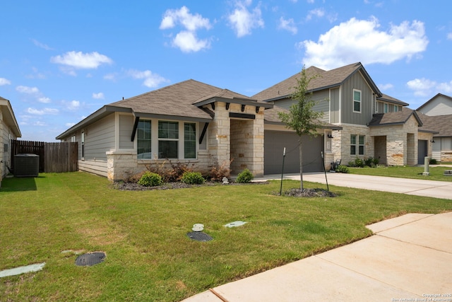 948 Black Horse Way, San Antonio, TX 78260 - view of front facade with stone siding, concrete driveway, central AC unit, a garage, and a shingled roof