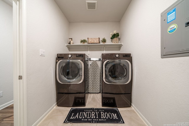 948 Black Horse Way, San Antonio, TX 78260 - washroom featuring washing machine and clothes dryer, baseboards, electric panel, and tile patterned flooring