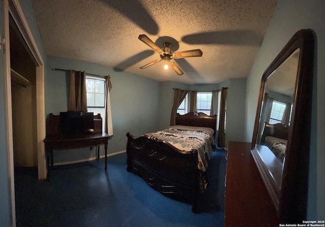 512 Brown Ln, Floresville, TX 78114 - bedroom with a textured ceiling, baseboards, and ceiling fan