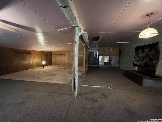 512 Brown Ln, Floresville, TX 78114 - below grade area with wood walls and carpet flooring