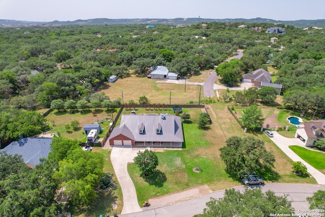 8718 Paseo Oaks, San Antonio, TX 78255 - aerial view of property and surrounding area with a heavily wooded area