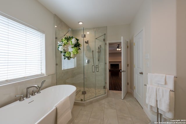 8718 Paseo Oaks, San Antonio, TX 78255 - full bath featuring a freestanding tub, a shower stall, marble finish flooring, and ceiling fan