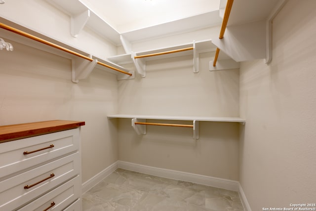 8718 Paseo Oaks, San Antonio, TX 78255 - walk in closet featuring light marble finish floors