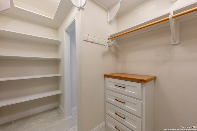 8718 Paseo Oaks, San Antonio, TX 78255 - walk in closet with light marble finish floors