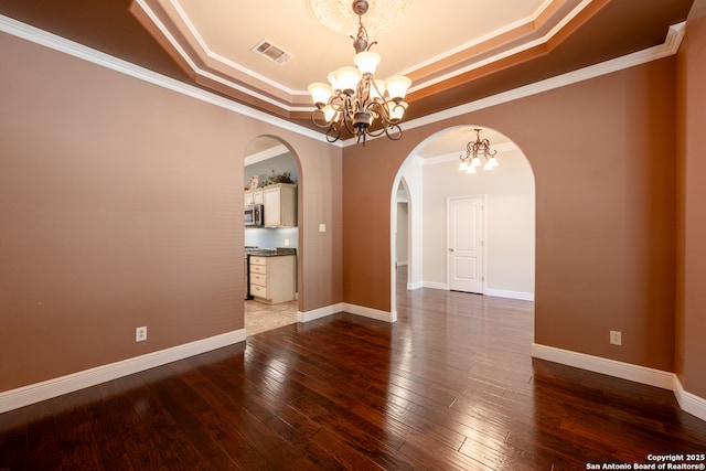 8718 Paseo Oaks, San Antonio, TX 78255 - empty room with a chandelier, a tray ceiling, arched walkways, dark wood-style flooring, and crown molding